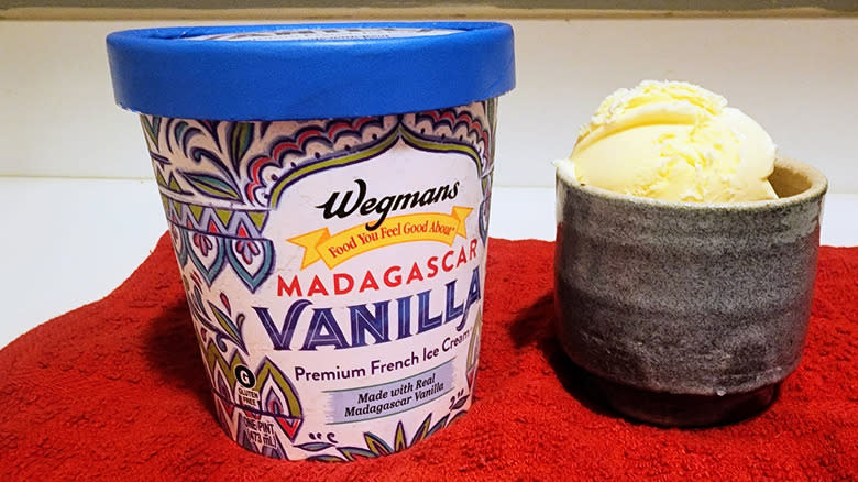 Pint and scoop of vanilla ice cream