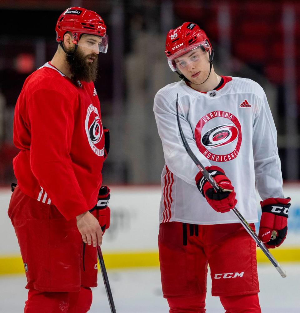Carolina Hurricanes defenseman Brent Burns talks with defenseman Scott Morrow (56) during practice on Thursday, May 2, 2024 at PNC Arena in Raleigh, N.C