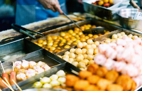 Curry fish balls in Hong Kong - Credit: Getty