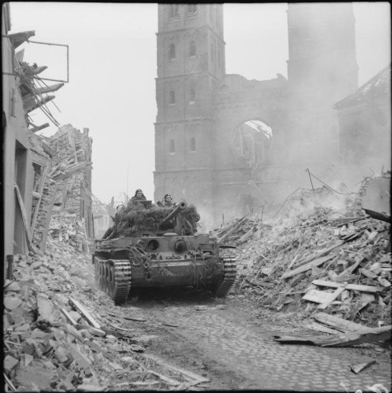 Eastern Daily Press: A Cromwell tank passes through ruins in the city of Emmerich, in northern Germany, as the Allies push towards Berlin