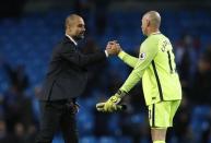 Britain Soccer Football - Manchester City v Manchester United - Premier League - Etihad Stadium - 27/4/17 Manchester City's Willy Caballero with manager Pep Guardiola at the end of the match Action Images via Reuters / Jason Cairnduff Livepic