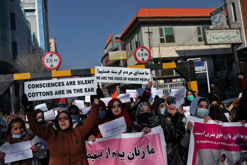 FILE PHOTO: Afghan women shout slogans during a rally to protest against what the protesters say is Taliban restrictions on women, in Kabul