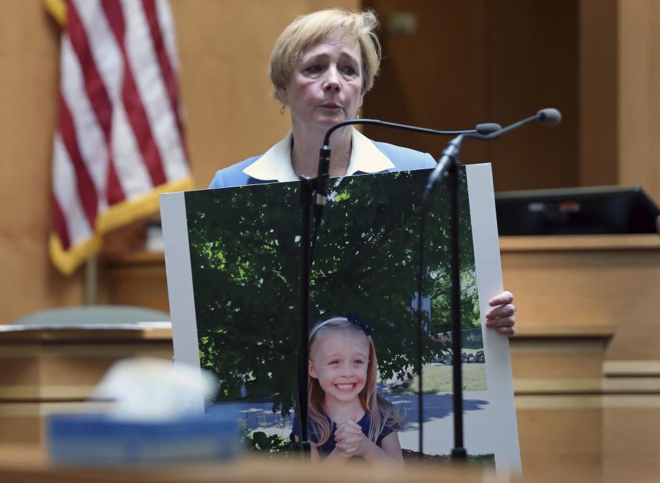 Defense attorney Caroline Smith displays a photograph of Harmony Montgomery to the jury during her closing argument in Adam Montgomery's trial, Wednesday, Feb. 21, 2024, in Manchester, N.H. Montgomery is accused of killing his 5-year-old daughter Harmony. (Jim Davis/The Boston Globe via AP, Pool)