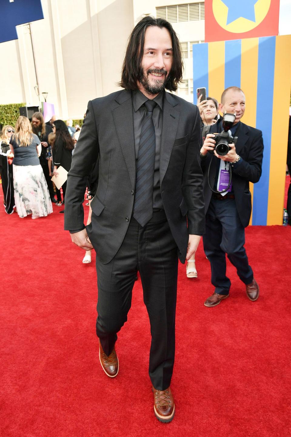 "Internet boyfriend" and one of the franchises new stars, Keanu Reeves, hit the carpet with a smile.