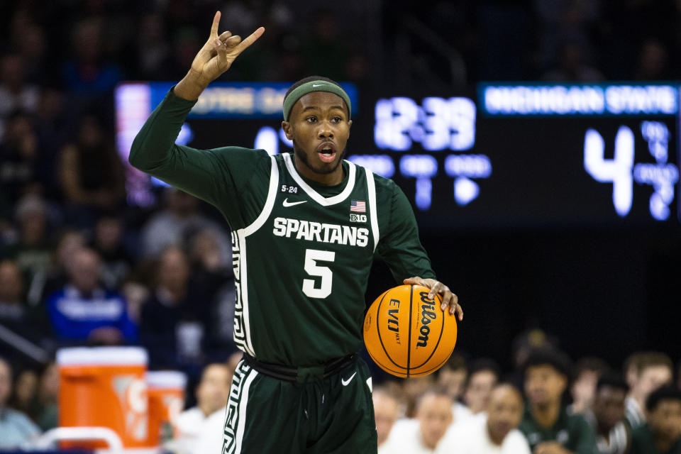 Michigan State's Tre Holloman calls a play during the first half of the team's NCAA college basketball game against Notre Dame on Wednesday, Nov. 30, 2022, in South Bend, Ind. (AP Photo/Michael Caterina)