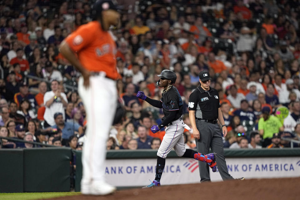 Miami Marlins' Jazz Chisholm Jr., right, runs the bases after hitting a two-run home run off Houston Astros starting pitcher Luis Garcia, left, during the fifth inning of a baseball game Friday, June 10, 2022, in Houston. (AP Photo/David J. Phillip)