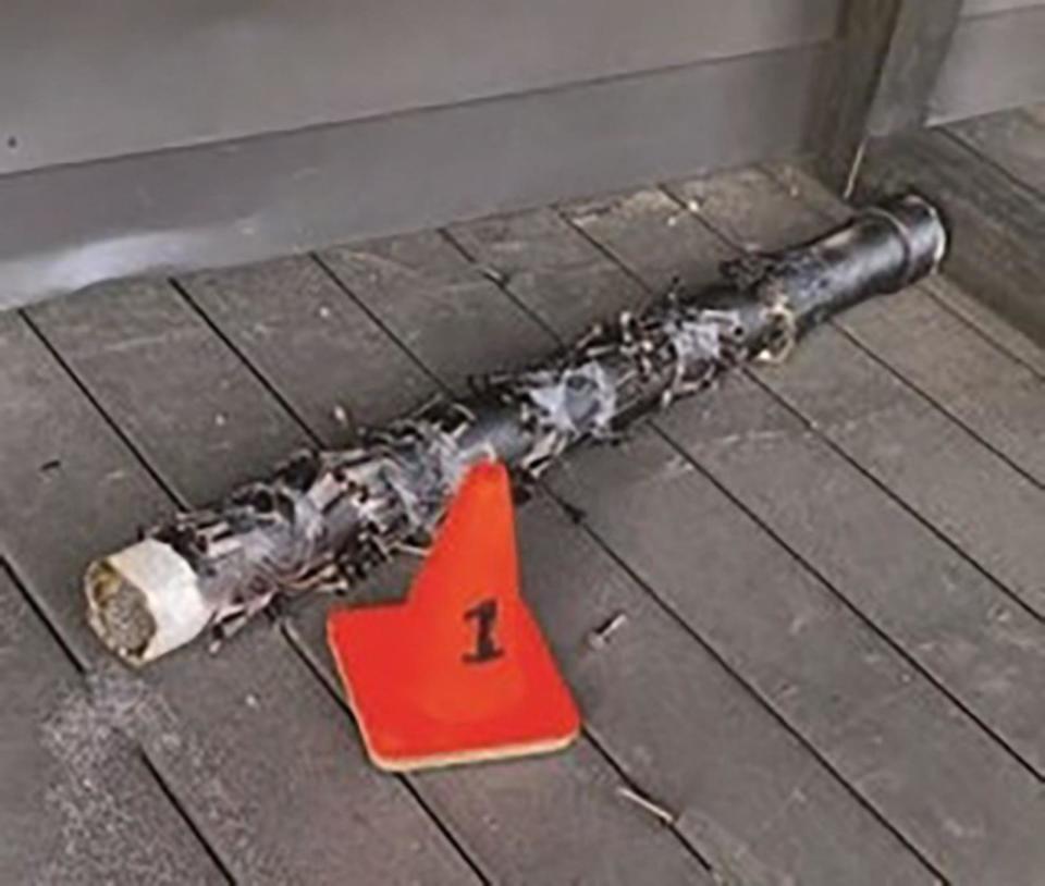 PHOTO: A partially detonated pipe bomb found outside The Satanic Temple on April 8, 2024, had nails taped to it, federal authorities said. (U.S. Department of Justice)