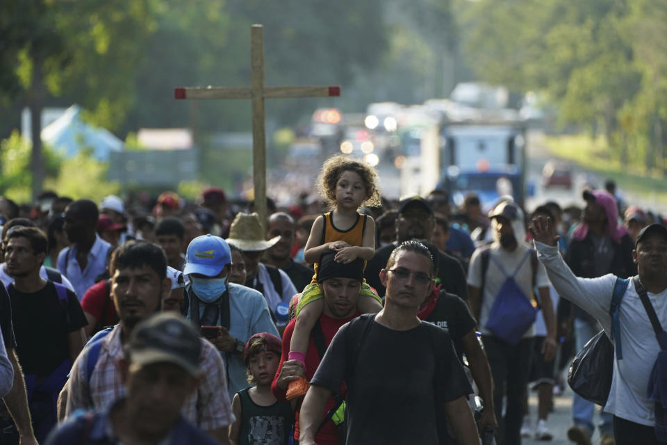 A caravan of migrants, mostly from Central America, heading north along coastal highway just outside of Huehuetan at Chiapas State, Mexico, on Sunday, Oct. 24, 2021. (AP Photo/Marco Ugarte)