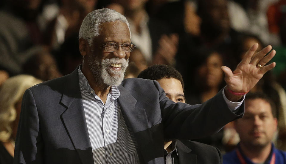 Former NBA player Bill Russell waves to the crowd during the NBA All Star basketball game, Sunday, Feb. 16, 2014, in New Orleans. (AP Photo/Gerald Herbert)