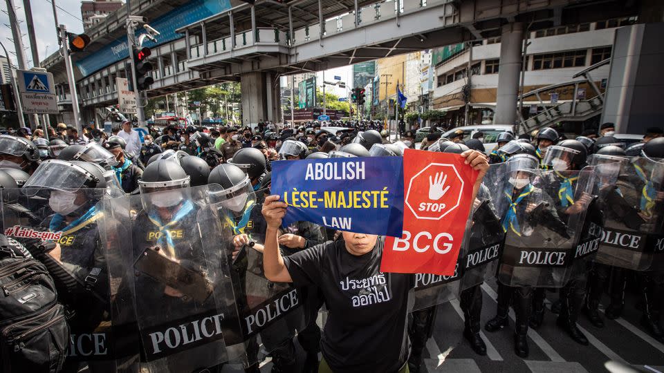A pro-democracy protester is surrounded by police at a demonstration in Bangkok on November 17, 2022. - Stringer/Anadolu Agency/Getty Images