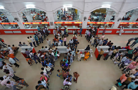 People wait in lines to deposit and withdraw money inside a post office in Lucknow, November 10, 2016. REUTERS/Pawan Kumar