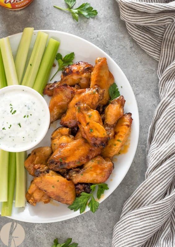 <p>Flavor the Moments</p><p>Instant Pot Honey Buffalo Chicken Wings are sticky, sweet and spicy buffalo wings with instructions on both pressure cooker and slow cooker methods!</p><p><a href="https://flavorthemoments.com/instant-pot-honey-buffalo-chicken-wings/" rel="nofollow noopener" target="_blank" data-ylk="slk:Get the Recipe;elm:context_link;itc:0;sec:content-canvas" class="link ">Get the Recipe</a></p>