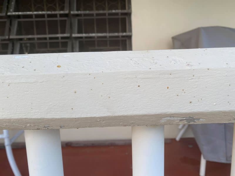 Specks of an oily substance cover a house in St. Croix