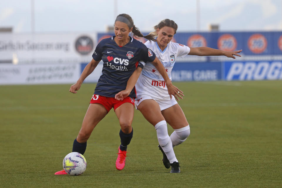 Chicago Red Stars' Bianca St. Georges, right, battles with Washington Spirit forward Ashley Hatch (33) during the first half of an NWSL Challenge Cup soccer match at Zions Bank Stadium, Saturday, June 27, 2020, in Herriman, Utah. (AP Photo/Rick Bowmer)