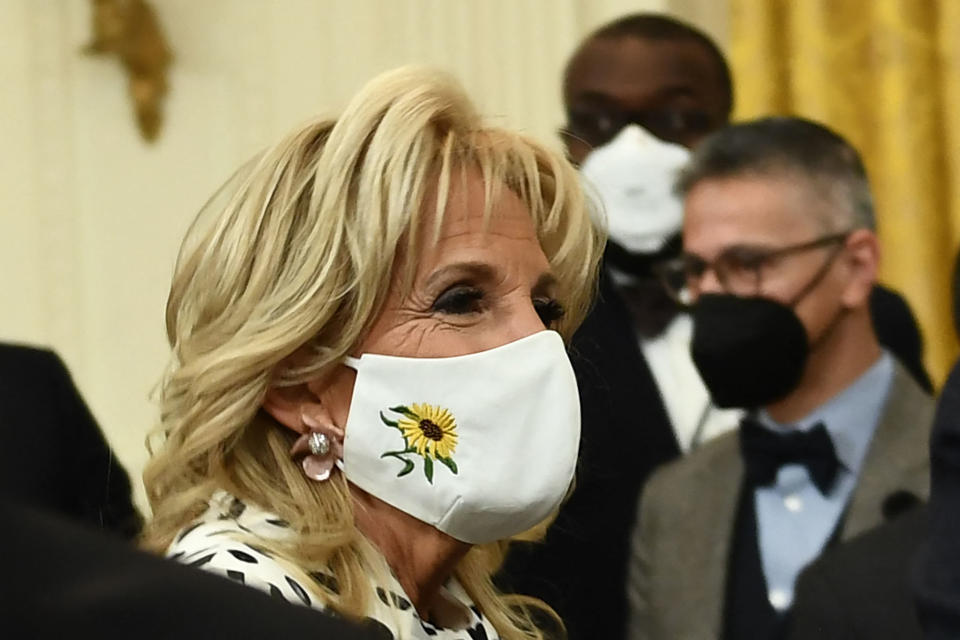 US first lady Jill Biden wears a sunflower mask, the national flower of Ukraine, in support for the Ukrainian people, during an event celebrating Black History Month in the East Room of the White House February 28, 2022, in Washington, DC. (Photo by Brendan Smialowski / AFP) (Photo by BRENDAN SMIALOWSKI/AFP via Getty Images)