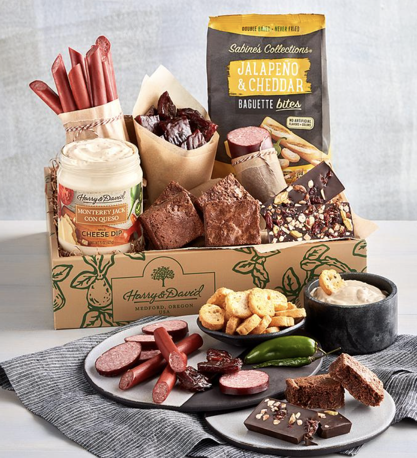 <p><strong>Harry & David</strong></p><p>Harry and David</p><p><strong>$74.99</strong></p><p>This snack box is sure to brighten his day! He'll find an array of delicious goodies inside — jalapeño cheddar bites and chocolate brownies included. You can even add a bottle of wine to sweeten the deal.</p>