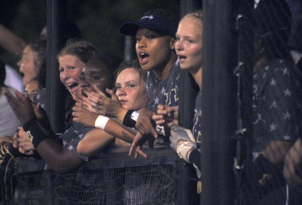 University Christian players cheer on teammates from the dugout in the seventh inning against Trinity Christian at the Florida High School Athletic Association Region 1-2A softball final on May 20, 2022. [Clayton Freeman/Florida Times-Union]