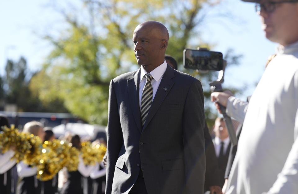 Colorado head coach Karl Dorrell arrives with his players at Folsom Field before an NCAA college football game against UCLA Saturday, Sept. 24, 2022, in Boulder, Colo. (AP Photo/David Zalubowski)