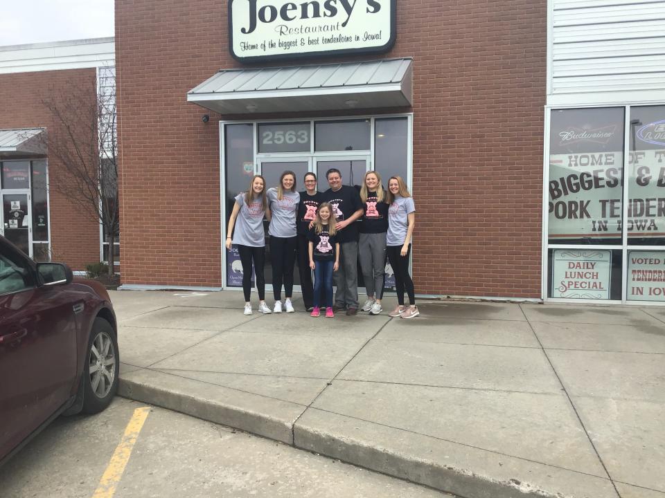 Brian Joens is pictured here with his wife and four daughters. Joens runs Joensy's, an Iowa City, Iowa, eatery that is famous for its pork tenderloin. Joens says he and his friends are being vigilant about the coronavirus, but they don't want government-issued edits to rule the day. Iowa is among a handful of states without governor-issued stay-at-home orders.