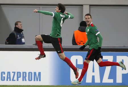 Athletic Bilbao's Mikel San Jose (L) and Borja Viguera celebrate after scoring a goal against Shakhtar Donetsk during their Champions League Group H soccer match at the Arena Lviv stadium in Lviv, November 25, 2014. REUTERS/Gleb Garanich