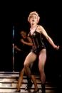 <p>On her 'Who's That Girl?' tour in gold and black nipple tassels by Jean Paul Gaultier. </p>