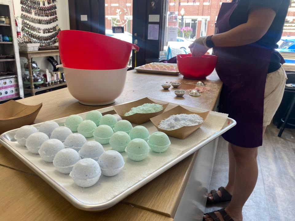 Kylie Paul makes bath bombs at Maggie's Farm and Aromatics on July 26, 2023.