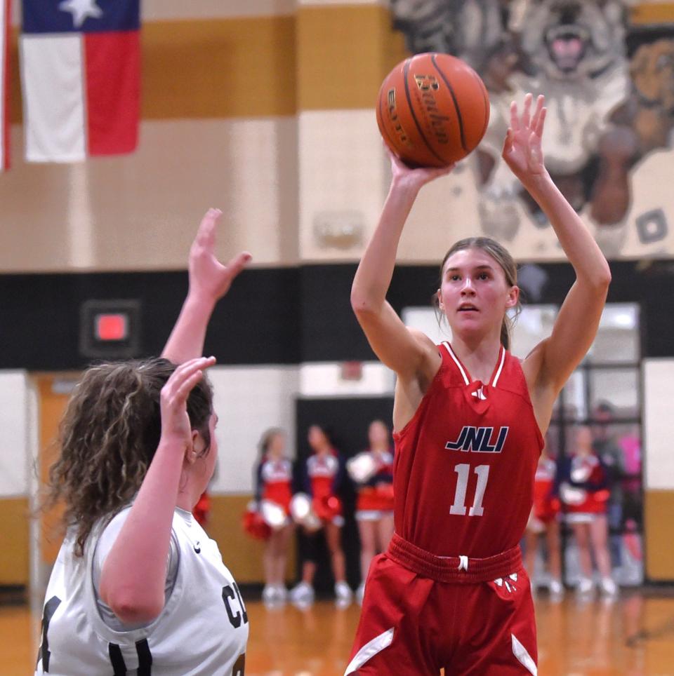 Jim Ned's Gracee Cooley (11) shoots over a Clyde defender in the first half. Jim Ned beat the Lady Bulldogs 78-22 in the District 6-3A game Friday, Jan. 12, 2024, at Clyde.