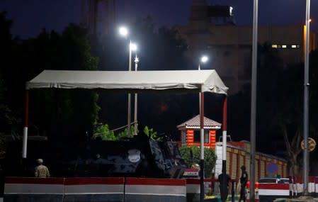 Police officers guard Cairo's Tora prison, where the trial of ousted Egyptian Islamist President Mohamed Mursi took place, in Cairo