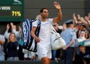 Tennis - Wimbledon - London, Britain - July 10, 2017 Spain’s Rafael Nadal waves as he walks off court after losing his fourth round match against Luxembourg’s Gilles Muller REUTERS/Matthew Childs