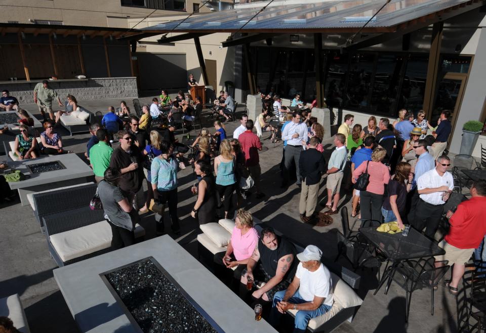 Patrons fill the outdoor deck at Hagemeister Park in Green Bay.