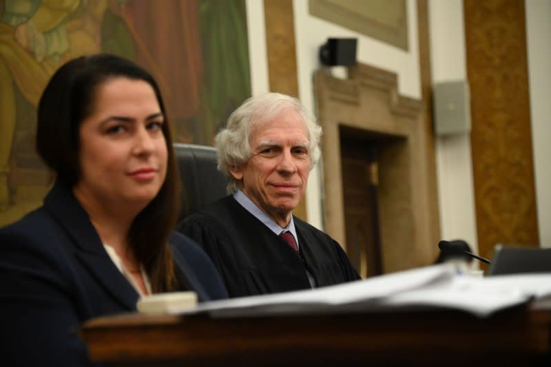 Judge Arthur Engoron and court clerk Allison Greenfield in the courtroom at State Supreme Court on December 7 in New York City. Engoron received a bomb threat at his New York home on Thursday. File Photo by Louis Lanzano/UPI