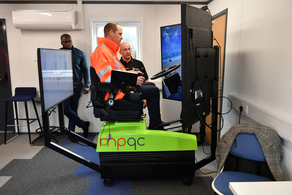 The Duke of Cambridge (left) operating an excavator simulator during a visit to the Tarmac National Skills and Safety Park in Nottinghamshire.