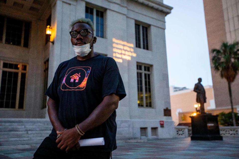 Niklaus Salvator, 28, poses for a portrait for the Miami Herald after speaking during a demonstration hosted by the Florida Housing Justice Alliance to protest the premature end of the eviction moratorium in front of the Miami-Dade County Courthouse in Downtown Miami, Florida on Tuesday, June 30, 2020.