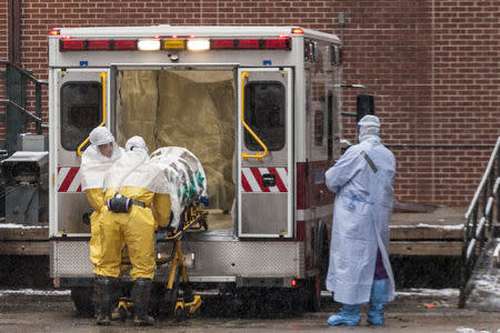 Dr. Martin Salia is placed on a stretcher upon his arrival at the Nebraska Medical Center Biocontainment Unit in Omaha, Nebraska, November 15, 2014. The Sierra Leonean surgeon who is critically ill with Ebola was flown to the United States from West Africa on Saturday and was transported to a Nebraska Medical Center for treatment, hospital officials said. Salia, 44, a permanent U.S. resident, caught Ebola working as a surgeon in a Freetown hospital, according to his family. REUTERS/Brian C. Frank