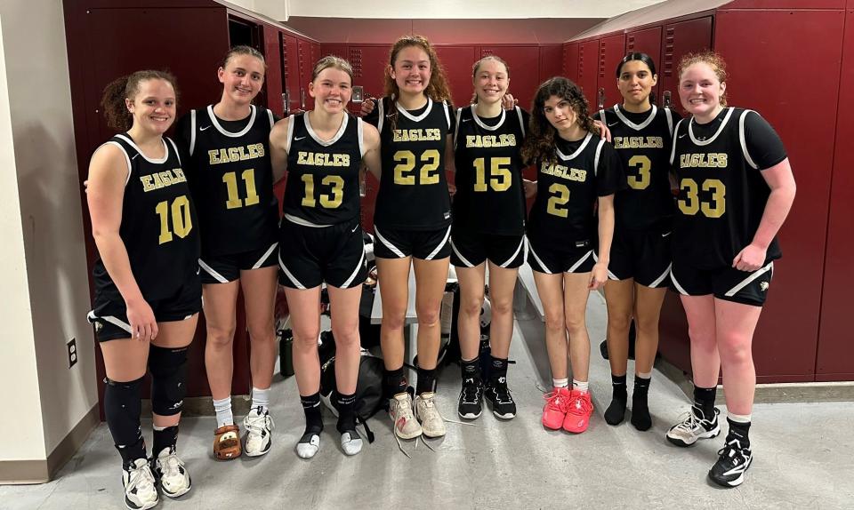 The Oak Park High girls basketball team poses for a photo after beating host Torrance 64-51 on Saturday to reach the CIF-SS Division 3AA championship game.