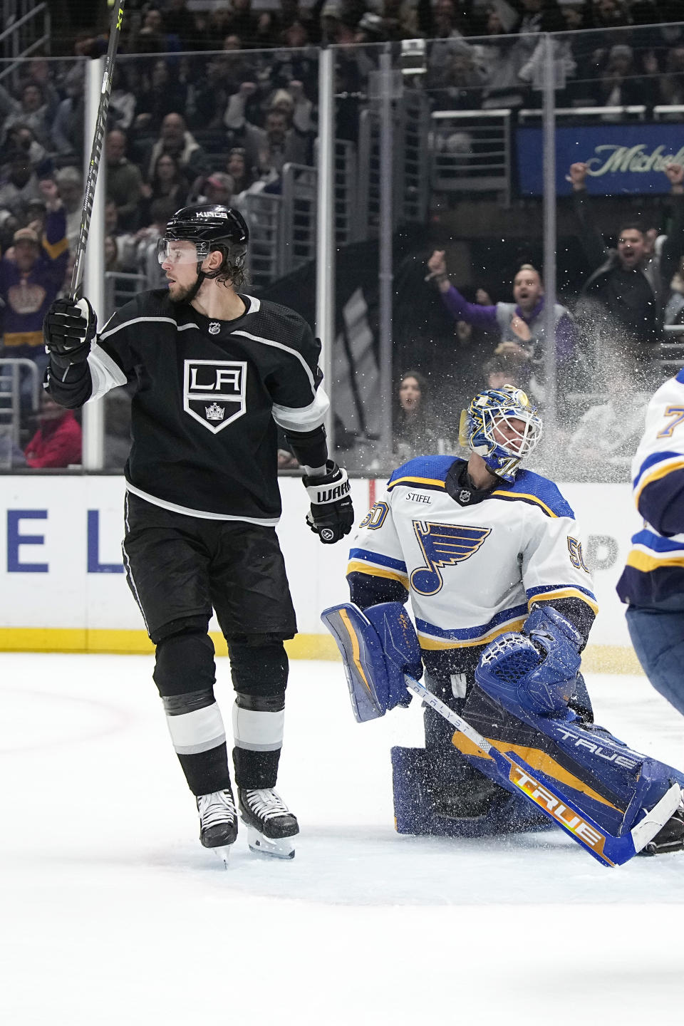 Los Angeles Kings right wing Adrian Kempe, left, celebrates his goal as St. Louis Blues goaltender Jordan Binnington looks inside the net during the second period of an NHL hockey game Saturday, March 4, 2023, in Los Angeles. (AP Photo/Mark J. Terrill)