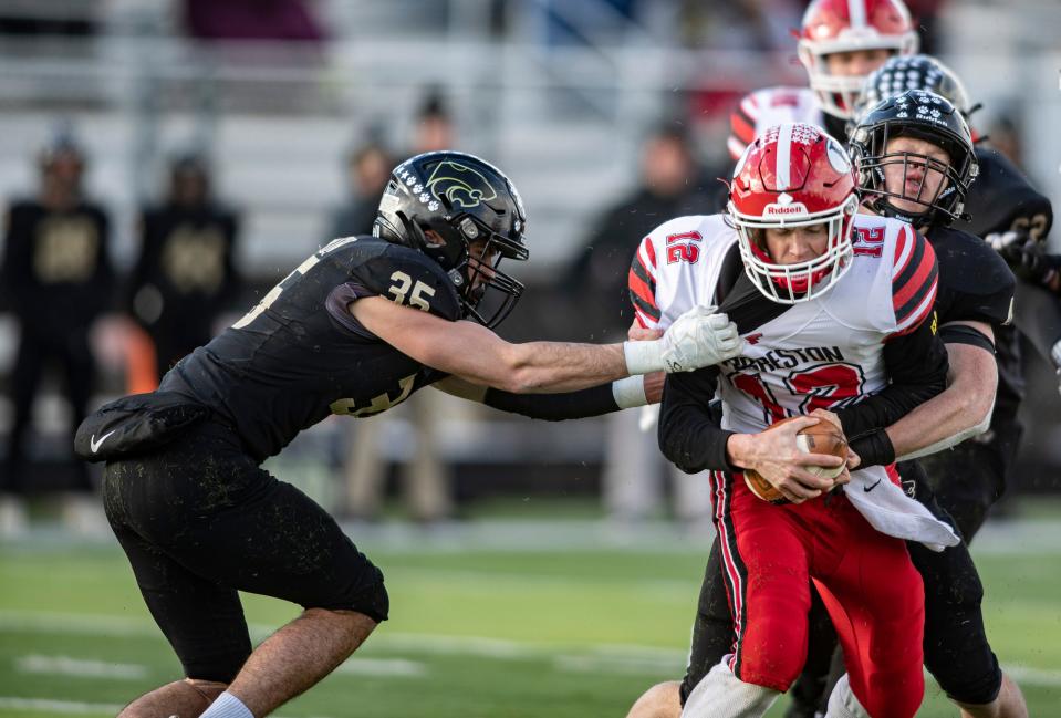 Lena-Winslow's Jace Flynn and Gage Dunker sack Forreston's Brock Smith on Saturday, Nov. 19, 2022, at Freeport High School in Freeport.