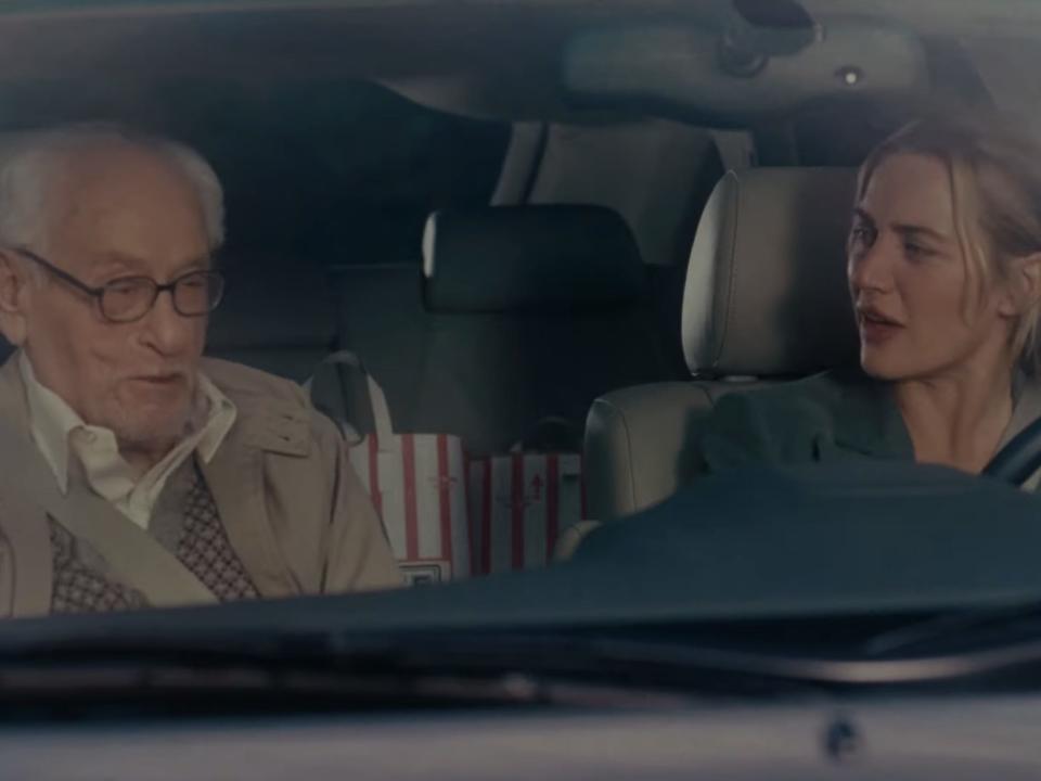 arthur and iris talking in a car in the holiday