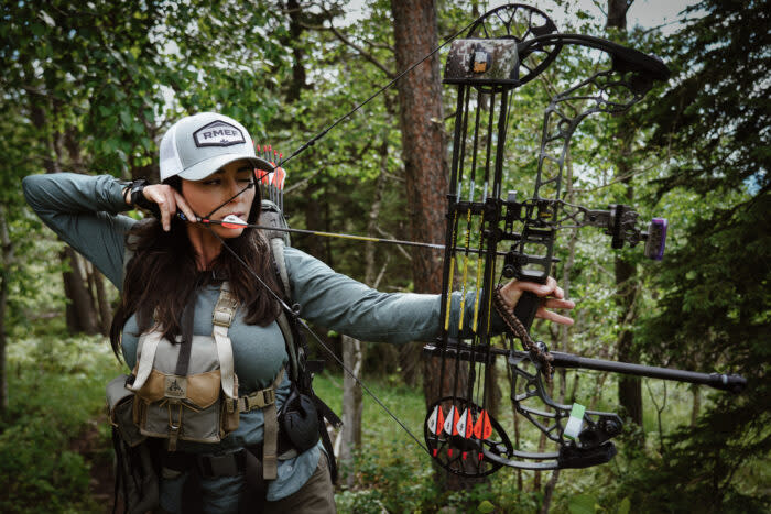 Author shooting a compound bow at a 3D archery competition; (photo/Rachelle Schrute)