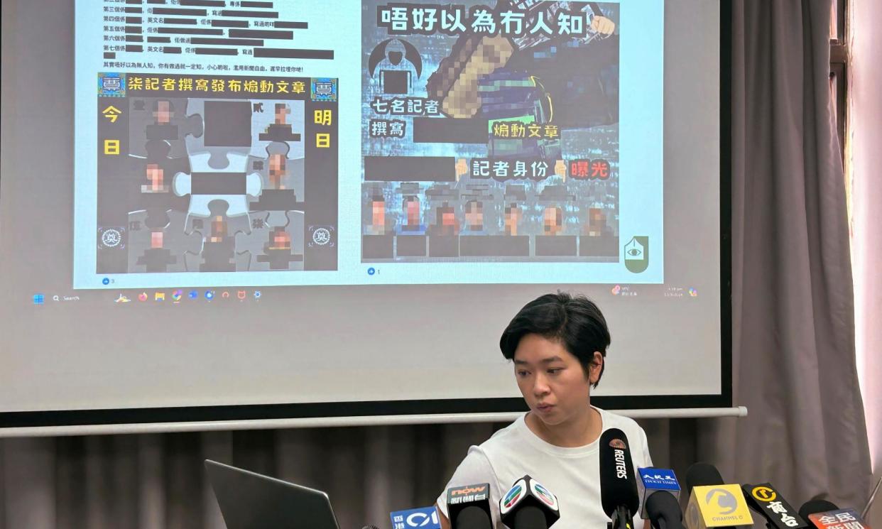 <span>Selina Cheng, chair of the Hong Kong Journalists Association, shows examples of Facebook posts intended to intimidate journalists.</span><span>Photograph: Kanis Leung/AP</span>