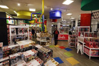 In this Tuesday, Nov. 5, 2019, photo shoppers browse the Fun & Games section at the Macy's flagship store in New York. With three weeks until the official start of the holiday shopping season, the nation’s retailers are gearing up for what will be another competitive shopping period. (AP Photo/Richard Drew)