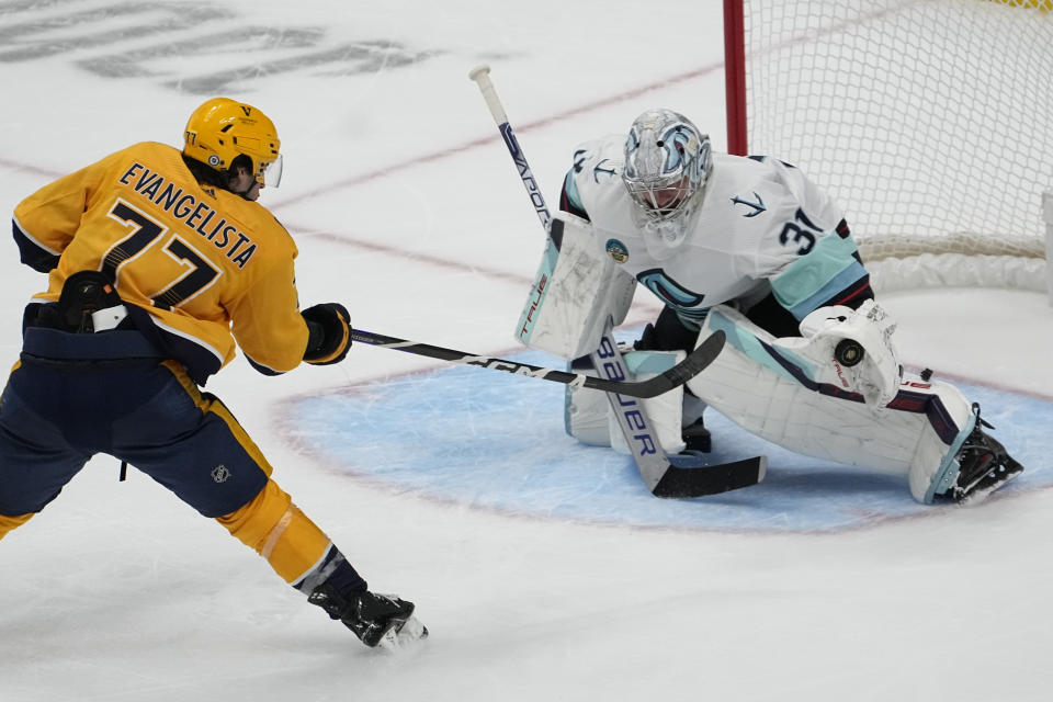 Seattle Kraken goaltender Philipp Grubauer (31) blocks a shot on goal by Nashville Predators right wing Luke Evangelista (77) during the third period of an NHL hockey game Thursday, Oct. 12, 2023, in Nashville, Tenn. The Predators won 3-0. (AP Photo/George Walker IV)