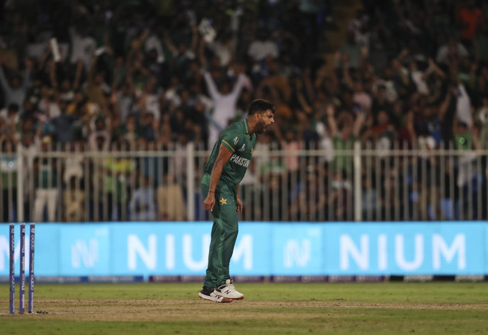Pakistan's Haris Rauf celebrates the dismissal of New Zealand's Mitchell Santner during the Cricket Twenty20 World Cup match between New Zealand and Pakistan in Sharjah, UAE, Tuesday, Oct. 26, 2021. (AP Photo/Aijaz Rahi)
