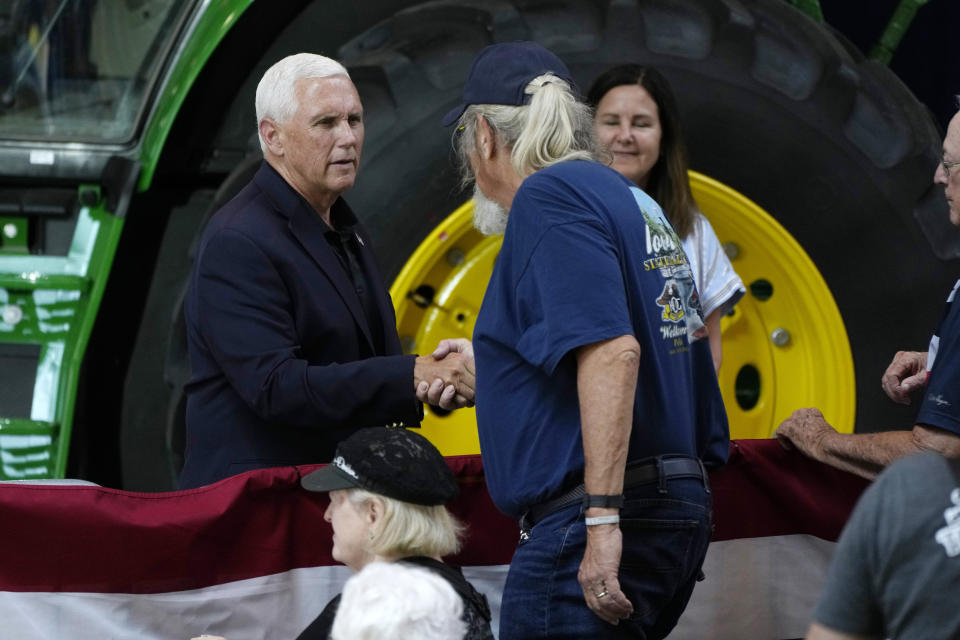 Former Vice President Mike Pence greets an audience member after speaking at U.S. Sen. Joni Ernst's Roast and Ride, Saturday, June 3, 2023, in Des Moines, Iowa. (AP Photo/Charlie Neibergall)