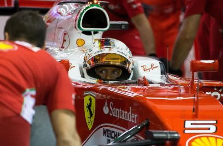 Formula One - Singapore Grand Prix - Marina Bay, Singapore - 17/9/16 Ferrari's driver Sebastian Vettel of Germany is seen after he retired from the qualifying session. REUTERS/Jeremy Lee