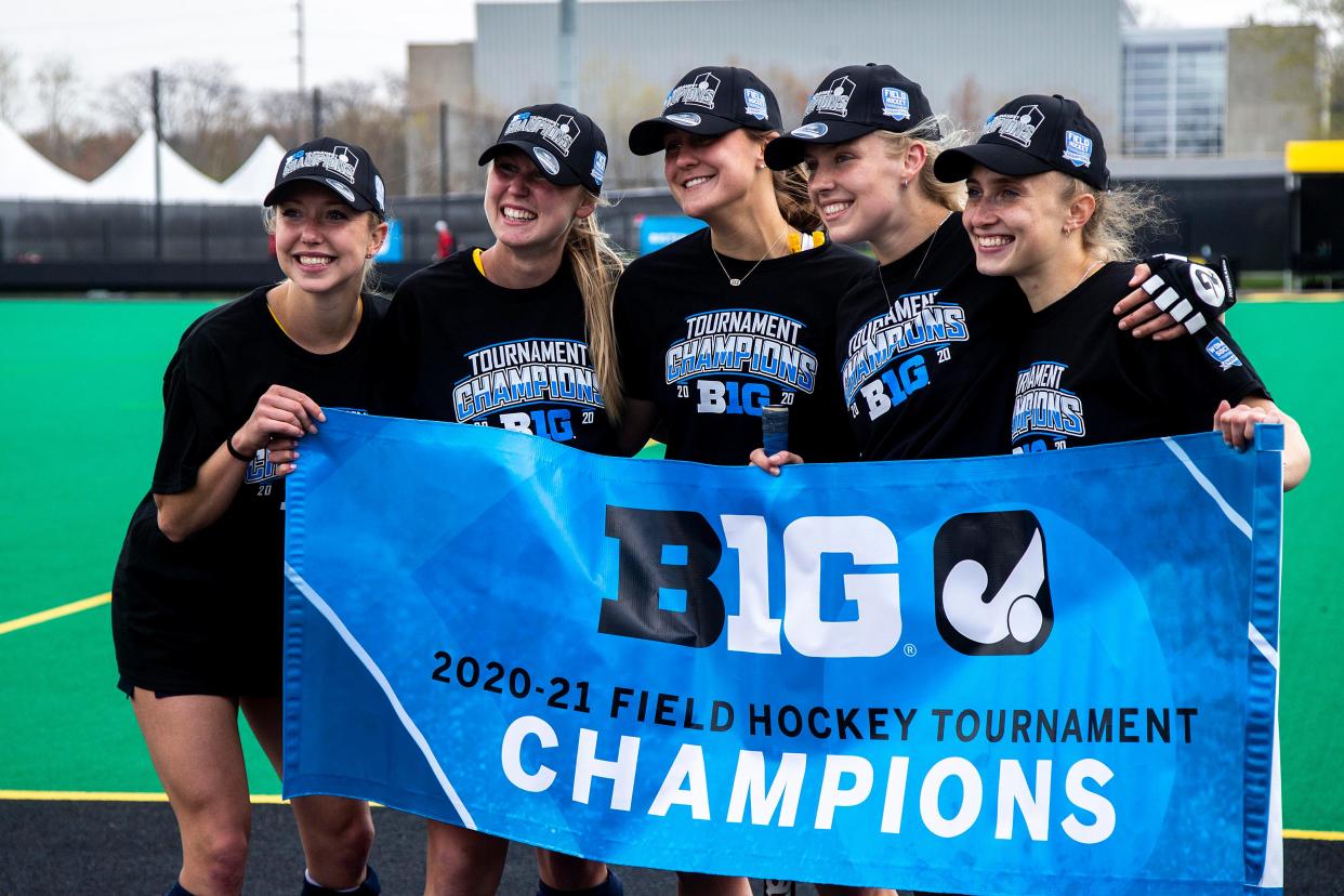 Michigan Wolverines players pose for photos after a Big Ten tournament championship field hockey match against Ohio State, Saturday, April 24, 2021, at Grant Field in Iowa City, Iowa. Michigan beat Ohio State 4-0.