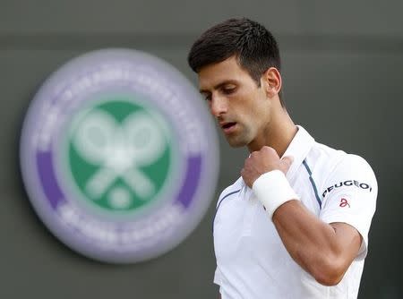 Novak Djokovic of Serbia reacts during his match against Kevin Anderson of South Africa at the Wimbledon Tennis Championships in London, July 6, 2015. REUTERS/Suzanne Plunkett