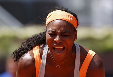 Serena Williams of the U.S. celebrates winning a point against Carla Suarez Navarro of Spain at the end of their match at the Madrid Open tennis tournament in Madrid, Spain, May 7, 2015. REUTERS/Andrea Comas