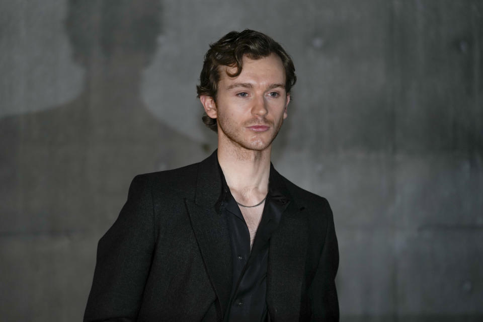 Harry Lawtey attends the men's Giorgio Armani Fall-Winter 2024-2025 collection, that was presented in Milan, Italy, Saturday, Jan. 13, 2024. (AP Photo/Luca Bruno).