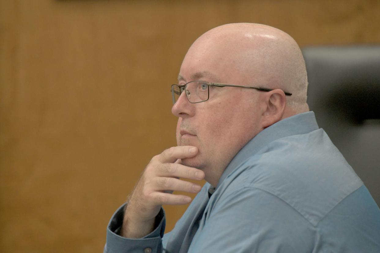 Former corrections officer Mark Cooper listens to opening statements on the first day of his trial in Richland County Common Pleas Court.